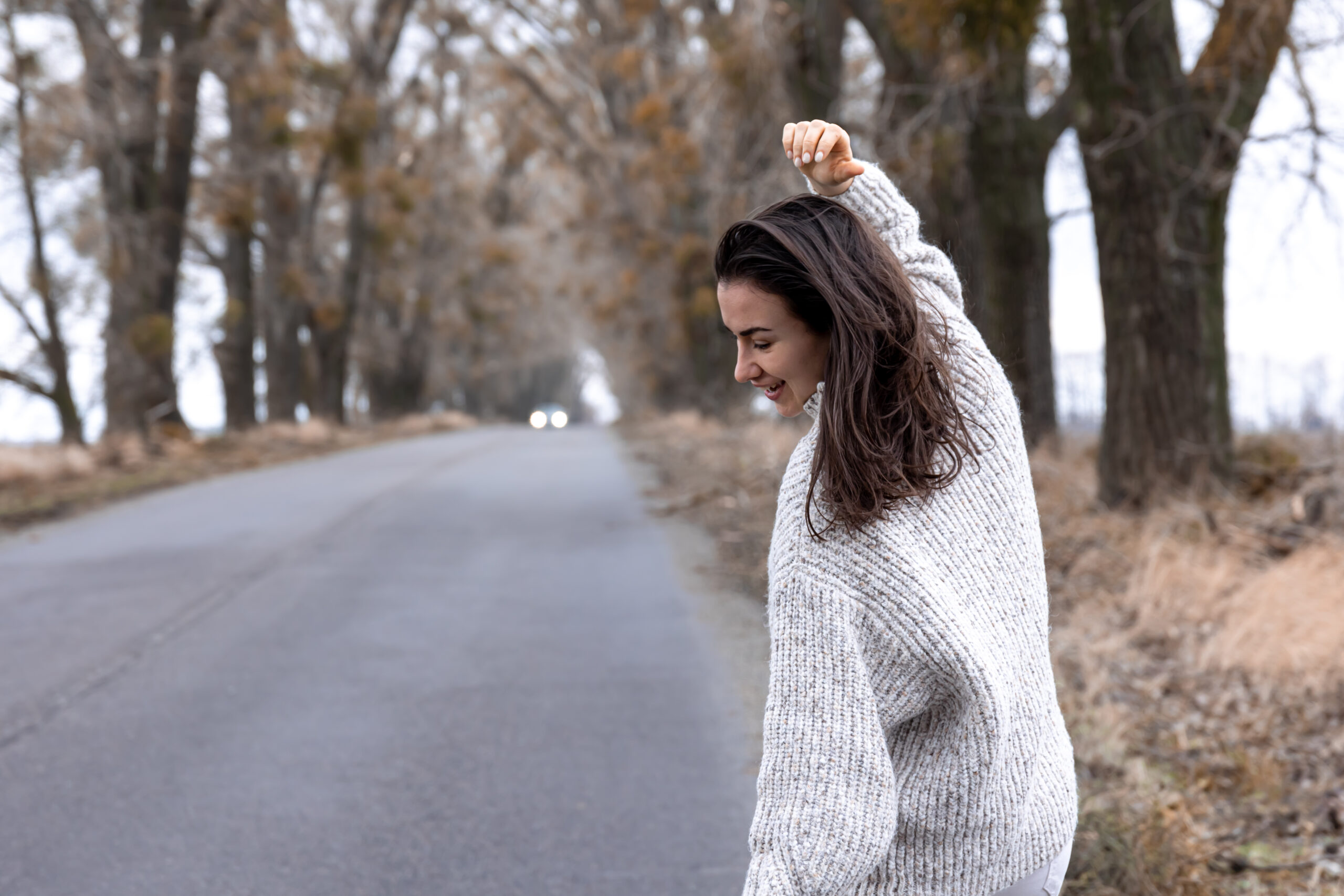 Middle-aged woman walking in a park during fall, pain-free