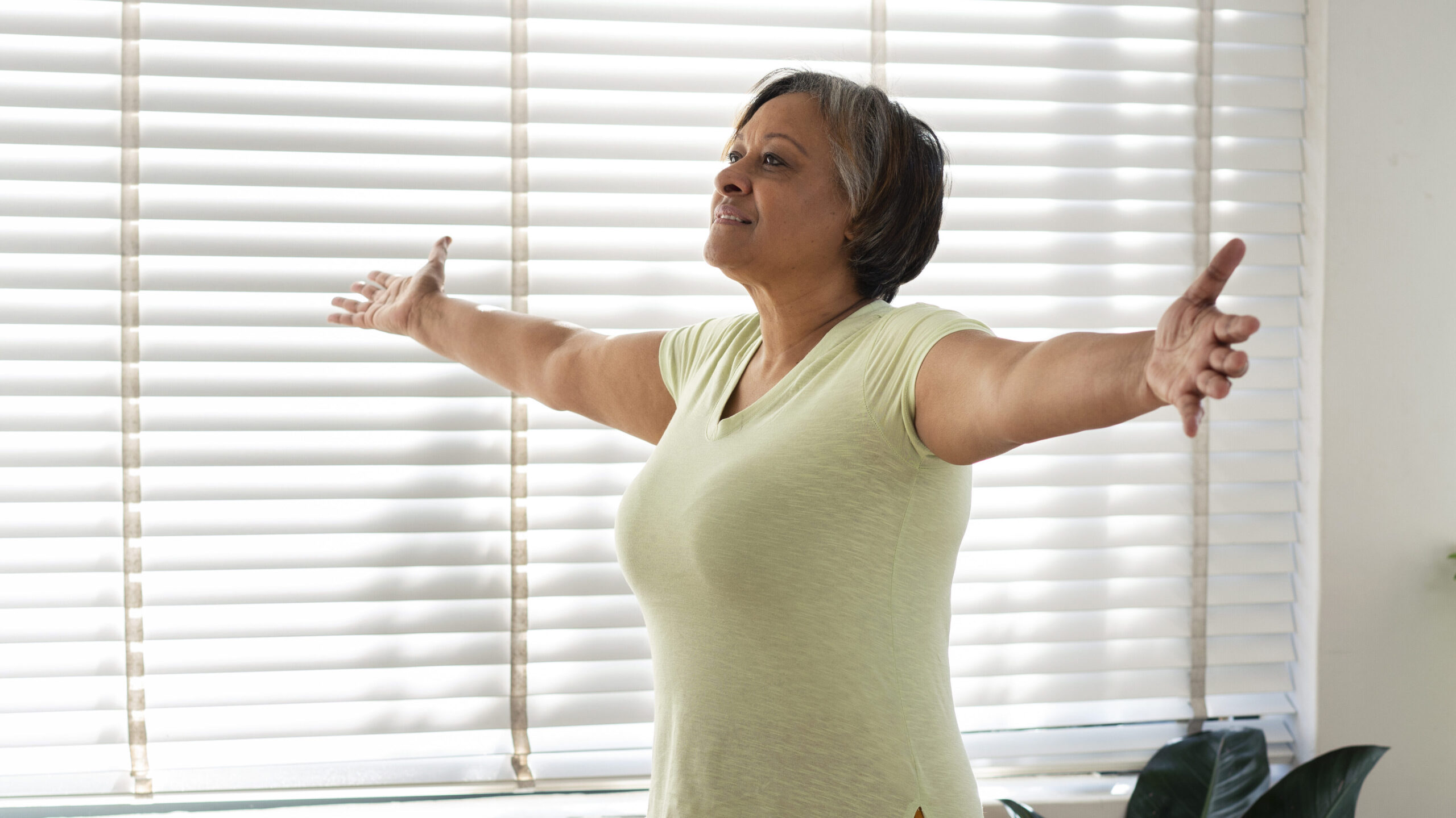Middle-aged woman stretching to improve mobility and energy after 45.